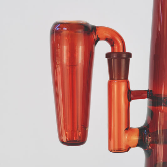 Close up of conical amber glass ash catcher, fit on a 90 degree joint bong