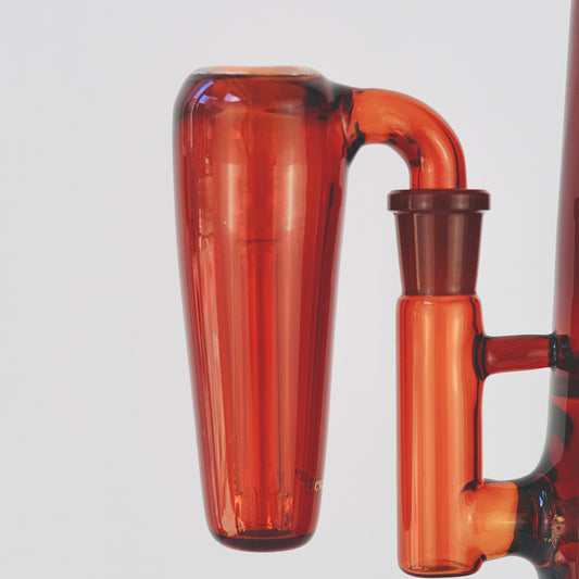 Close up of conical amber glass ash catcher, fit on a 90 degree joint bong