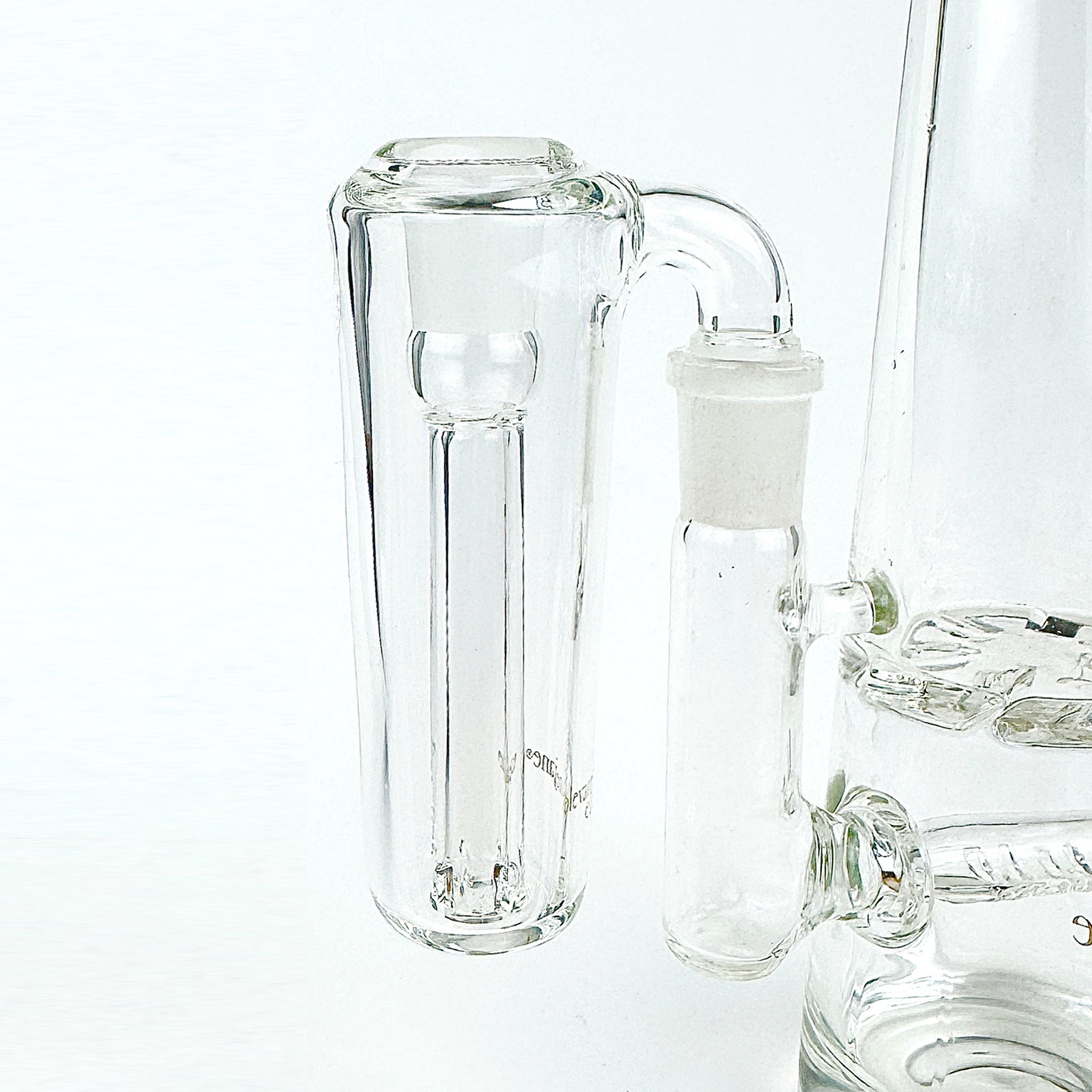 Close up of conical clear glass ash catcher, fit on a 90 degree joint bong