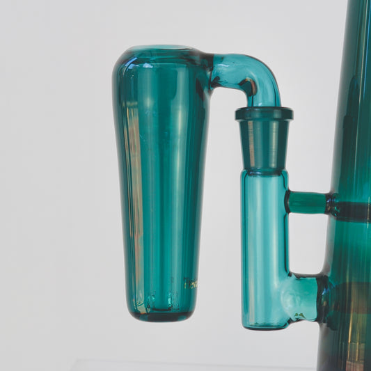 Close up of conical teal glass ash catcher, fit on a 90 degree joint bong