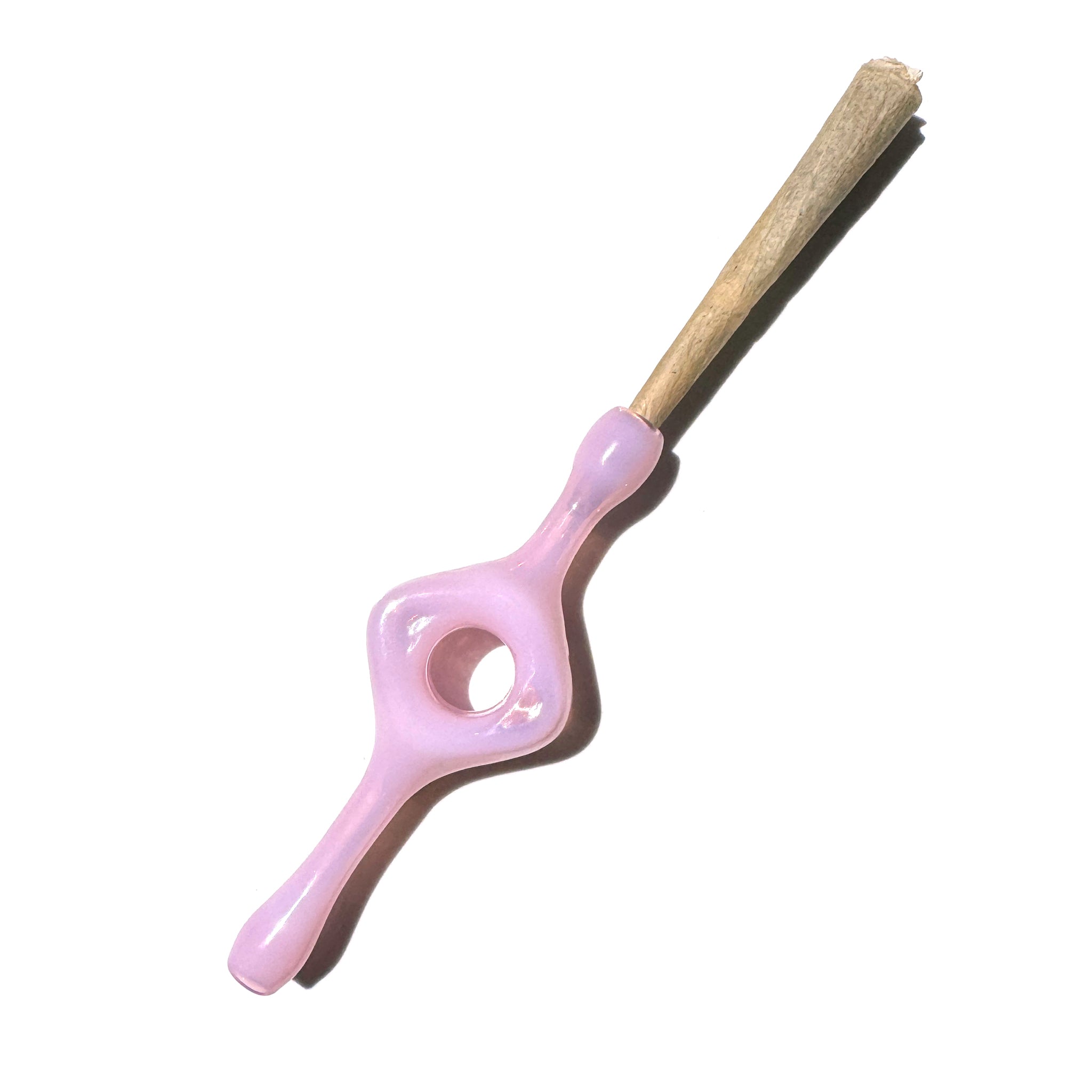 A milky pink glass joint holder with a hole in the middle designed for better grip and a smoother smoke. 
