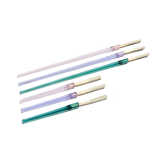 Side by side of the 12 inch Cruella joint holders with the 5 inch Cruella joint holders. Both sizes pictured in transparent pink, purple, and teal glass.