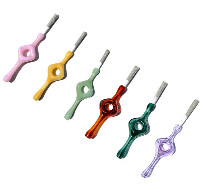 6 glass joint holders with a hole in the middle designed for better grip and a smoother smoke. Colors from left to right: Milky Pink, Mustard, Mint, Amber, Teal, Purple