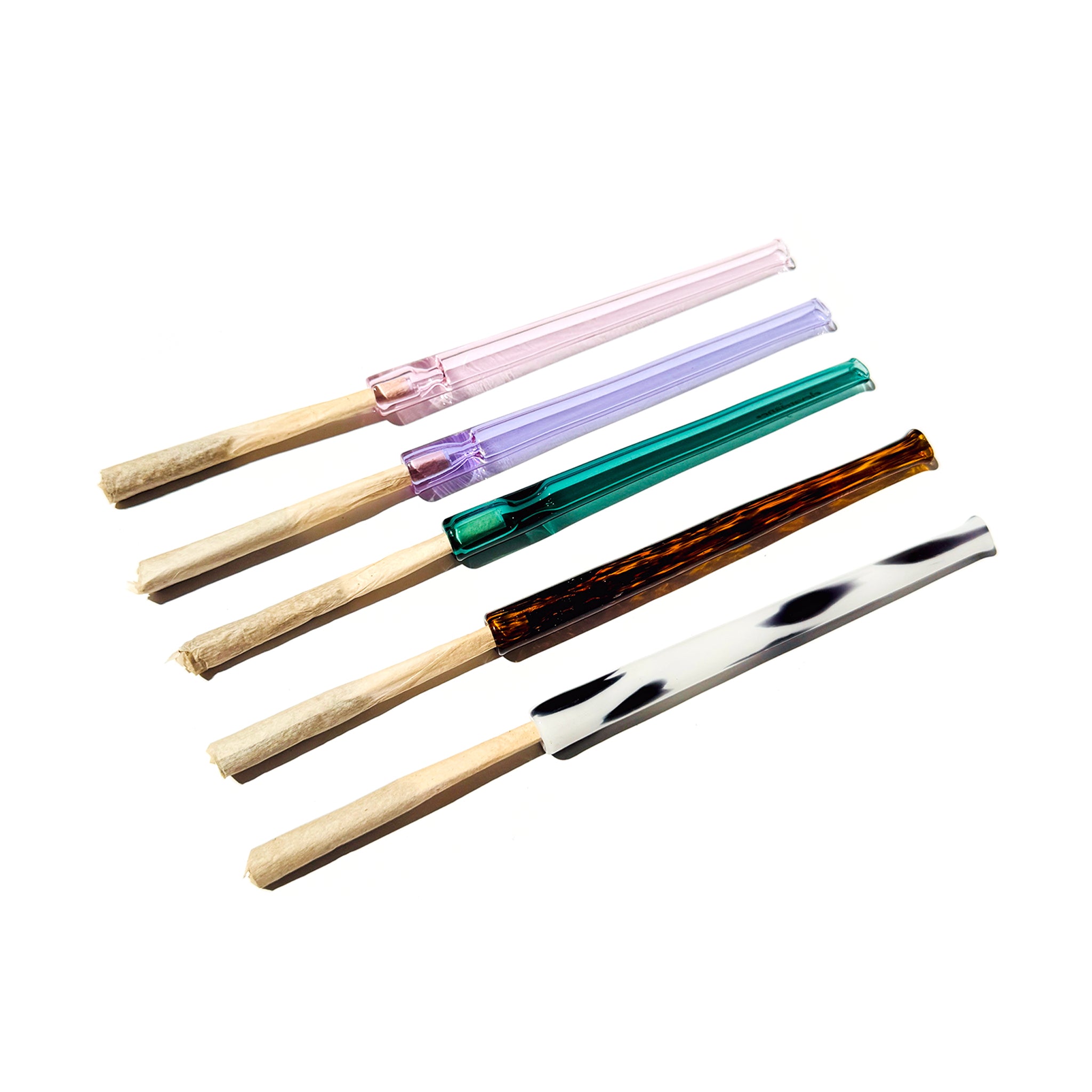 Five beautiful Cruella joint holders lined up. Glass colors from top to bottom are: pink, purple, teal, tortoise shell, and dalmation print