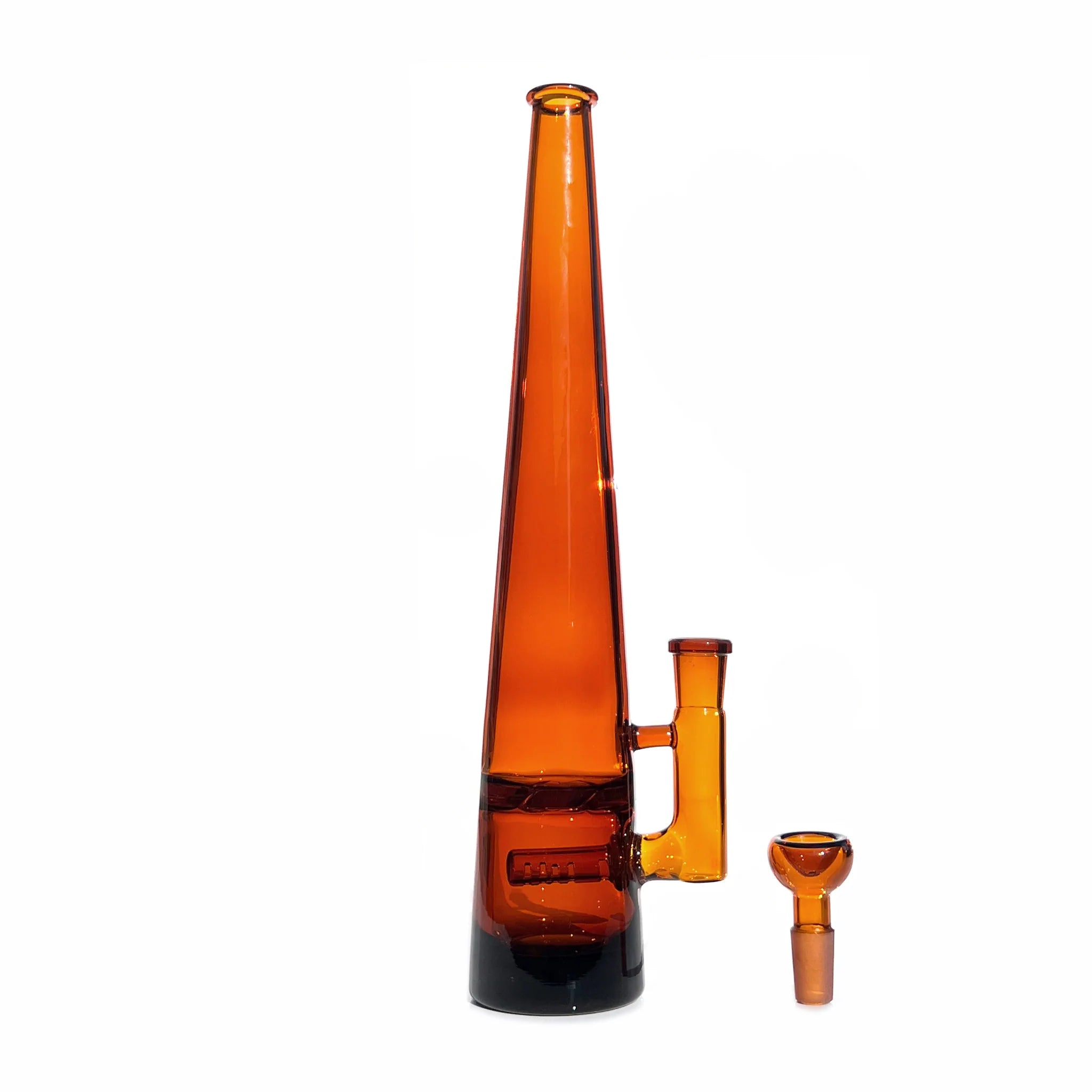 12 inch tall monochromatic amber glass bong, standing tall with joint to right, bowl piece on the surface next to the base